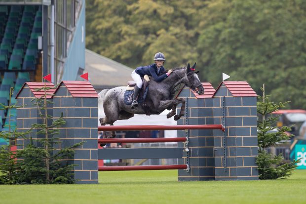 Emily Irvine and Runard Lass win the RIHS showjumping JC championship