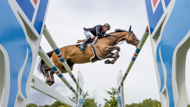 John Whitaker and Equine America Unick du Francport clear an oxer