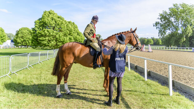 H&H’s current showing editor Alex Robinson carrying out an interview at Royal Windsor Horse Show in 2022.
