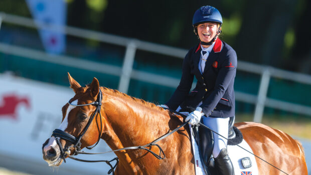 Georgia Wilson gives a wide smile after her Freestyle Grade II test at the Dressage European Championship Risenbeck 2023. Paralympic dressage
