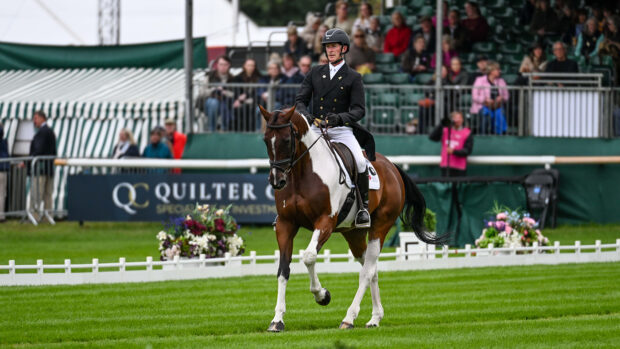 Declan Cullen canters down the centre line at Defender Burghley Horse Trials on Seavaghan Ash.