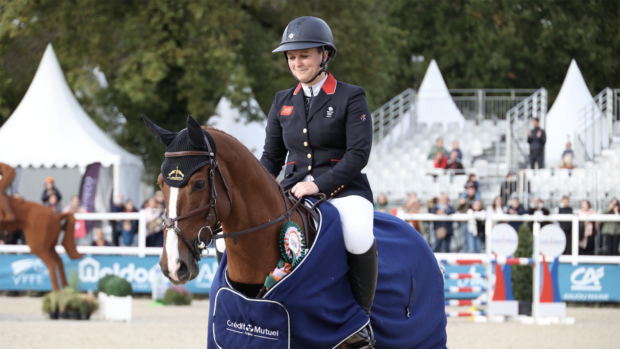 Gemma Stevens sits on Chilli Morning IV wearing his winners rug for the seven-year-old class at Le Lion.