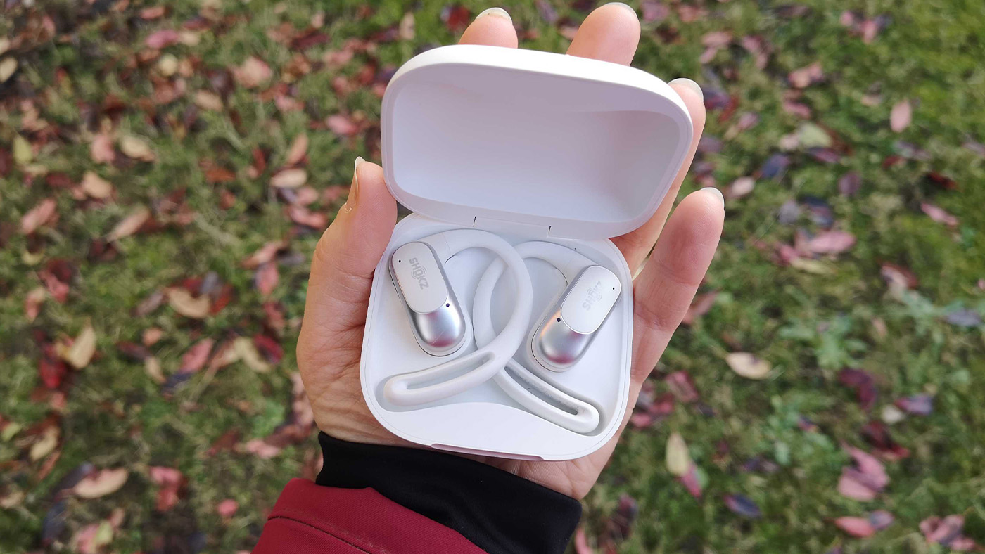 Shokz headphones in hand