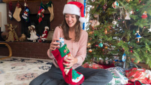 Woman opening Christmas stocking