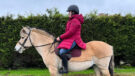 Pikeur Renee Rain Coat side on, worn on horse