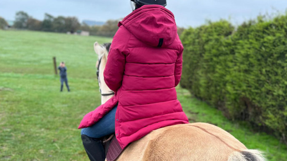 Pikeur Renee Rain Coat on horse from rear