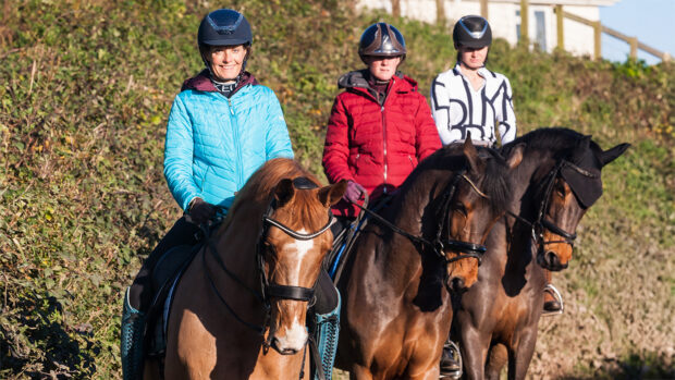Anna Ross and two other members of her team hacking out