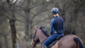 Rider facing away from camera wearing Racesafe Motionlite back protector