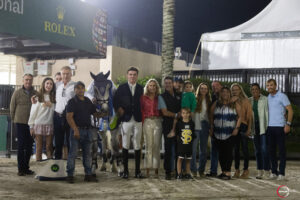 Showjumping news - Tim Brennan of Ireland is surrounded by his visiting family after winning the under-25 grand prix at WEF.
