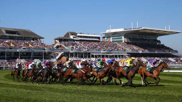 General view of horses running in the Grand National at Aintree Racecourse