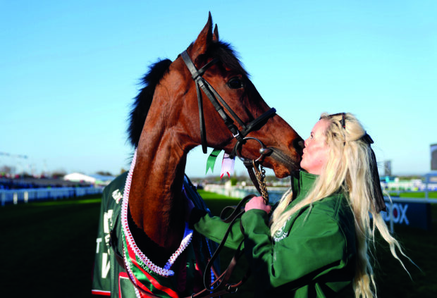 2025 Randox Grand National winner Nick Rockett with his groom Katie Walton.