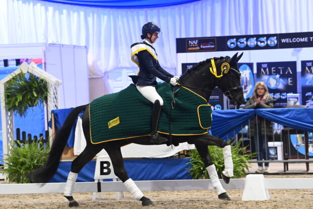 Lauren Burrows and Beaux Lyon win the Baileys Horse Feeds novice freestyle silver at the NAF Five Star Winter Dressage Championships