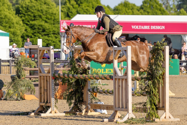 Ruby Ward and Noble Banksy clear a jump on their way to winning the intermediate working hunter and being crowned working hunter pony champions
