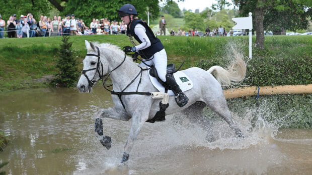 Heartbreaker Star Quality and Libby Seed splash through the pond after jumping the angled brush on the Badminton cross-country course 2025.