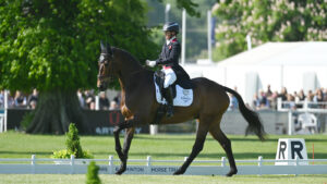 Ros Canter and Lordships Graffalo canter down the long side of the Badminton Horse Trials dressage arena