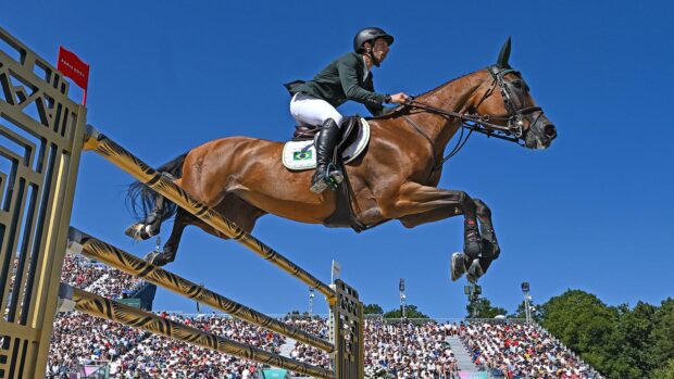 Yuri Mansur of Team Brazil, on Miss Blue, during the Jumping Individual Qualifier at the Château de Versailles during the 2024 Paris Summer Olympic Games.