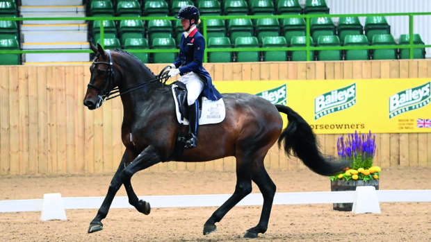 Laura Tomlinson and Full Moon in canter competing at Hartpury.