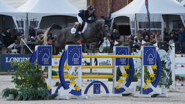 Millie Allen and Clearround Il Mondo Z jump a yellow oxer in the Nations Cup competition at Peelbergen in the Netherlands.
