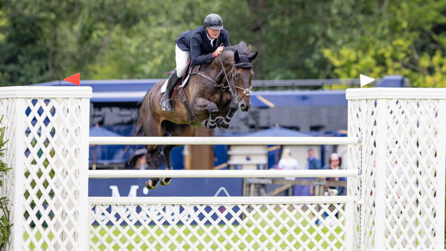 James Whitaker and Just Call Me Henry jump a vertical on the way to winning the Queen Elizabeth II Cup at the Royal International Horse Show 2025