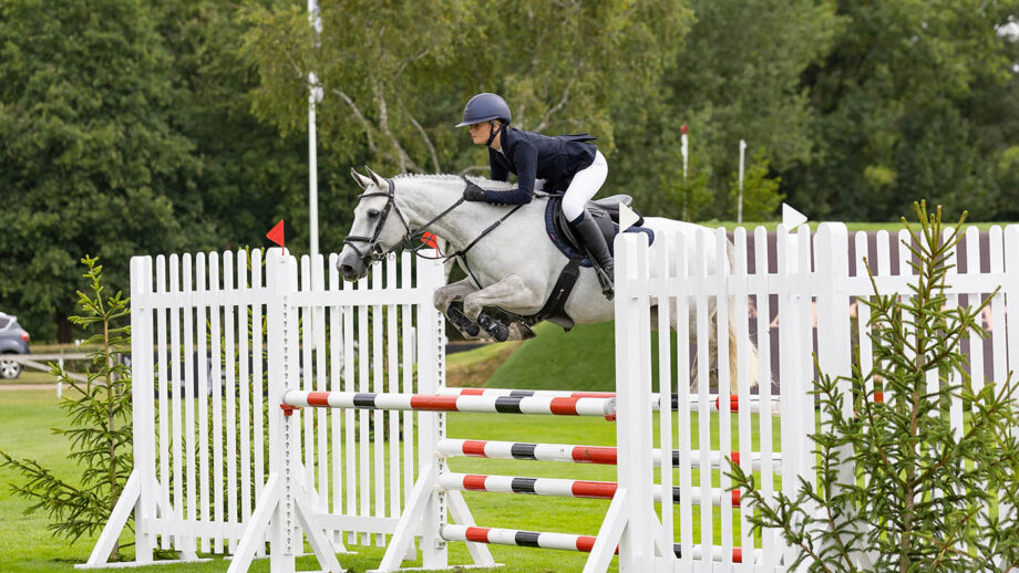 Gabriella Douglas jumps on oxer at the Hickstead Royal International Horse Show on Farravaune Shannen