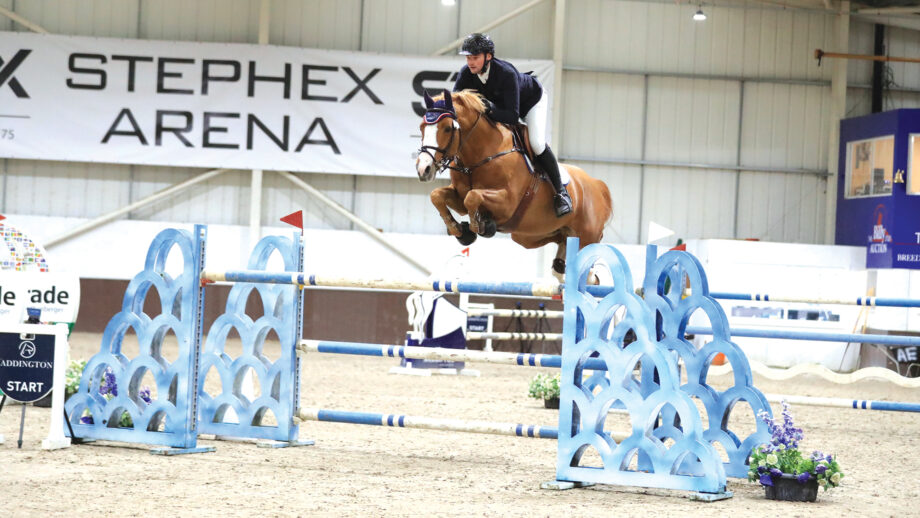 Ronnie Lee Jones jumps a large blue and white oxer on Key West