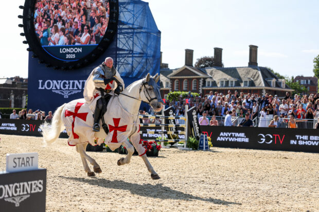 John Whitaker dressed as a knight in shining armour to celebrate his 70th birthday at the Longines Global Champions Tour of London 2025.