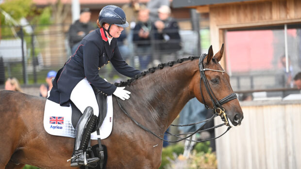 Becky Moody pats Jagerbomb after their grand prix special test at the 2025 European Championships