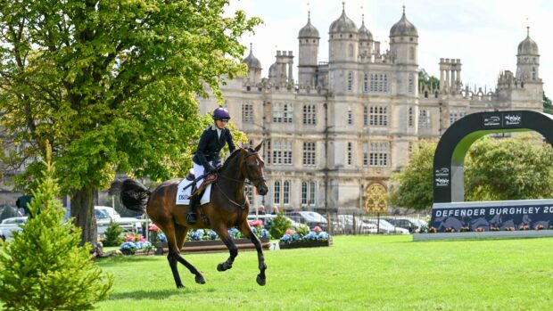 2025 Burghley Young Event Horse five-year-old winner Quantum Leap, with Piggy March, canter in front of Burghley House.