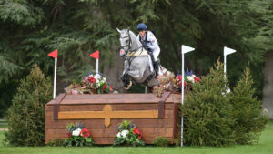Bubby Upton and Its Cooley Time clear a large wooden chest on the 2025 Blenheim European Eventing Championships.