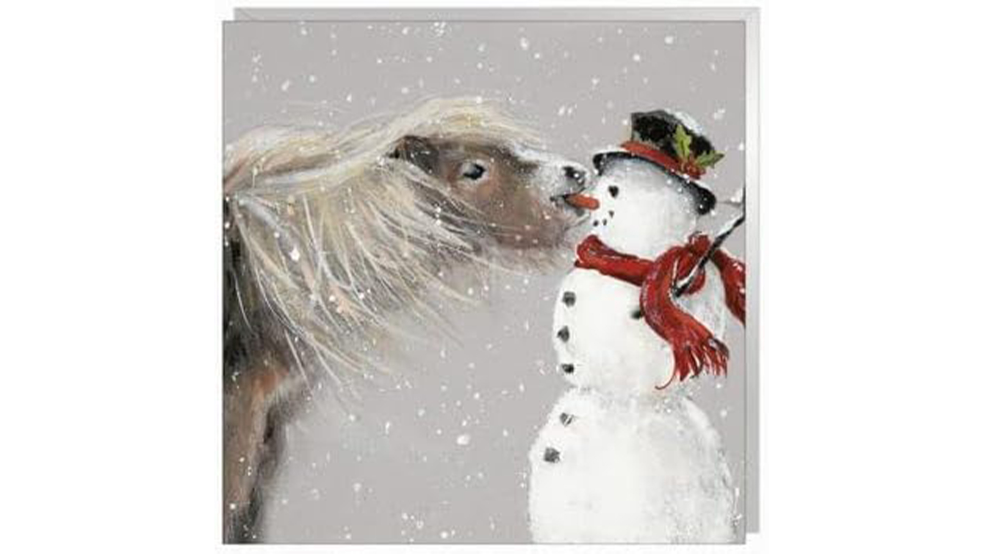 Christmas card showing horse biting carrot nose off a snowman