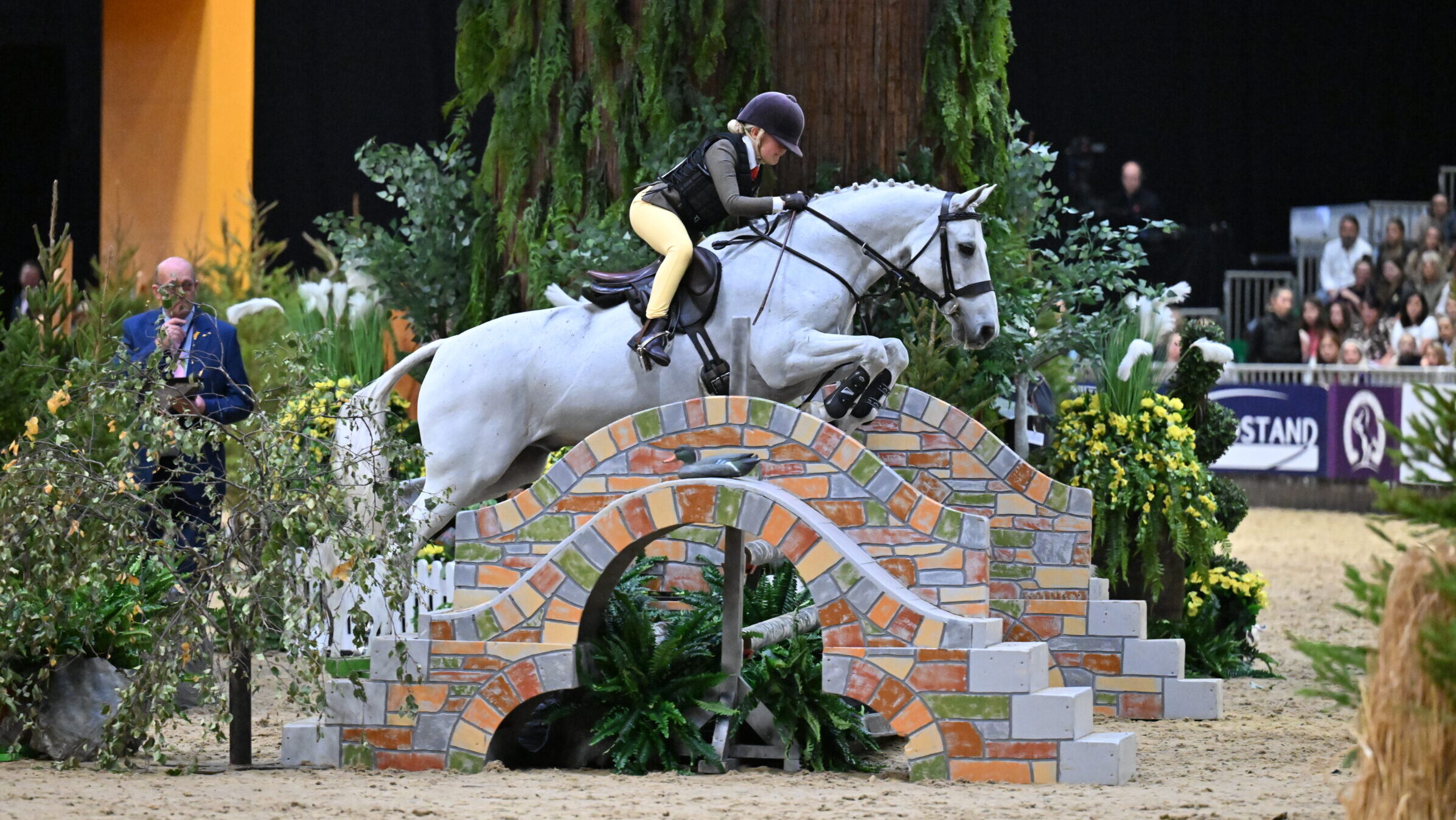 Connemara pony Tullibards Silver Mine and Anya Dewey Clarke jump to victory in the 143cm plaited workers