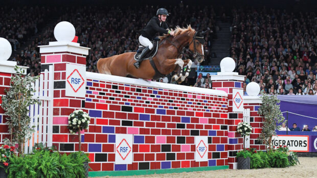 Joseph Trunkfield riding Senators Rhondaigo in the puissance competition at HOYS in 2021