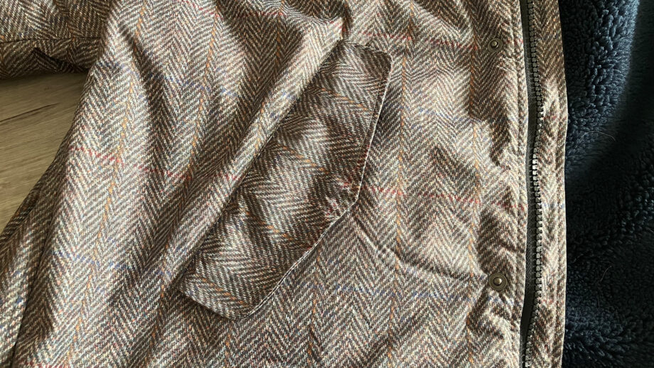 Hestt Eco-Ultra riding robe close up view of storm flap over pocket