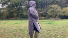 Lady wearing Hestt Eco-Ultra Riding Robe with hood up side view