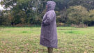 Lady wearing Hestt Eco-Ultra Riding Robe with hood up side view