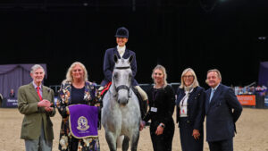 Jane Hemmings and The Boss are presented with their sash in the overall Search for a Star championship at HOYS