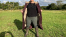 Lady wears LeMieux All Elements Robe in a field unzipped, viewed from the front