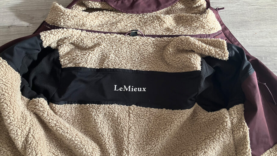 LeMieux All Elements Robe on the floor with a close up of air vents inside the coat