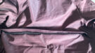LeMieux All Elements Robe on the floor with a close up of air vents on the outside of coat