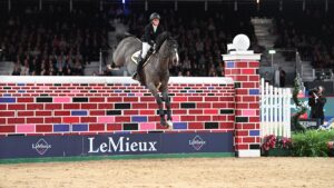 Rachel Proudley and Easy Boy winning puissance at London