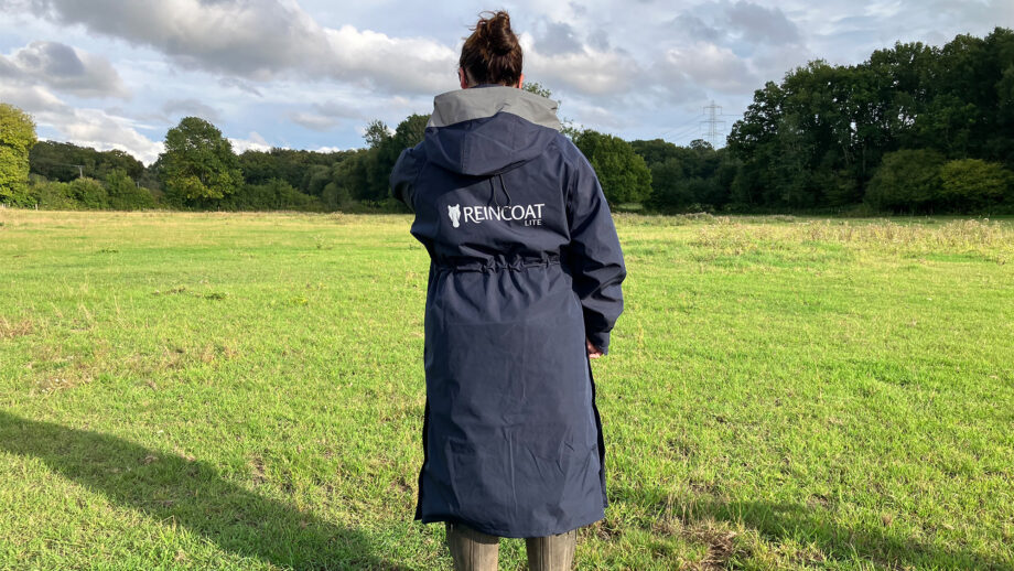 Lady wears Reincoat Lite, viewed from the back
