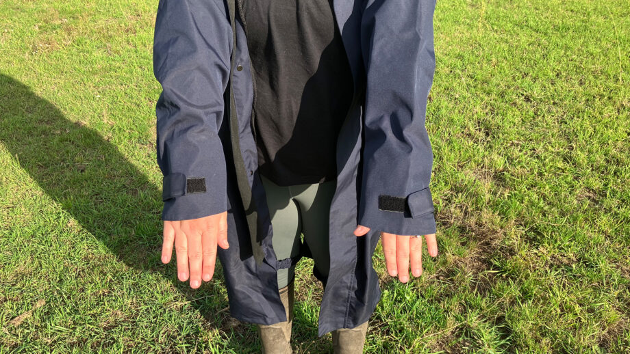 Lady wears Reincoat Lite, showing a close up of cuffs