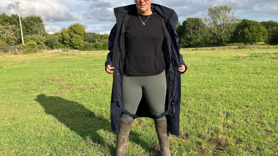 Lady wears Reincoat Lite, viewed from the front showing the coat unzipped