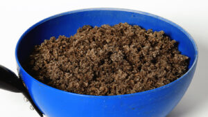Close up of soaked sugar beet in a Stubbs scoop