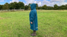 Lady wearing Two Bare Feet Hi-Vis Lightweight Riding Robe with hood up side view