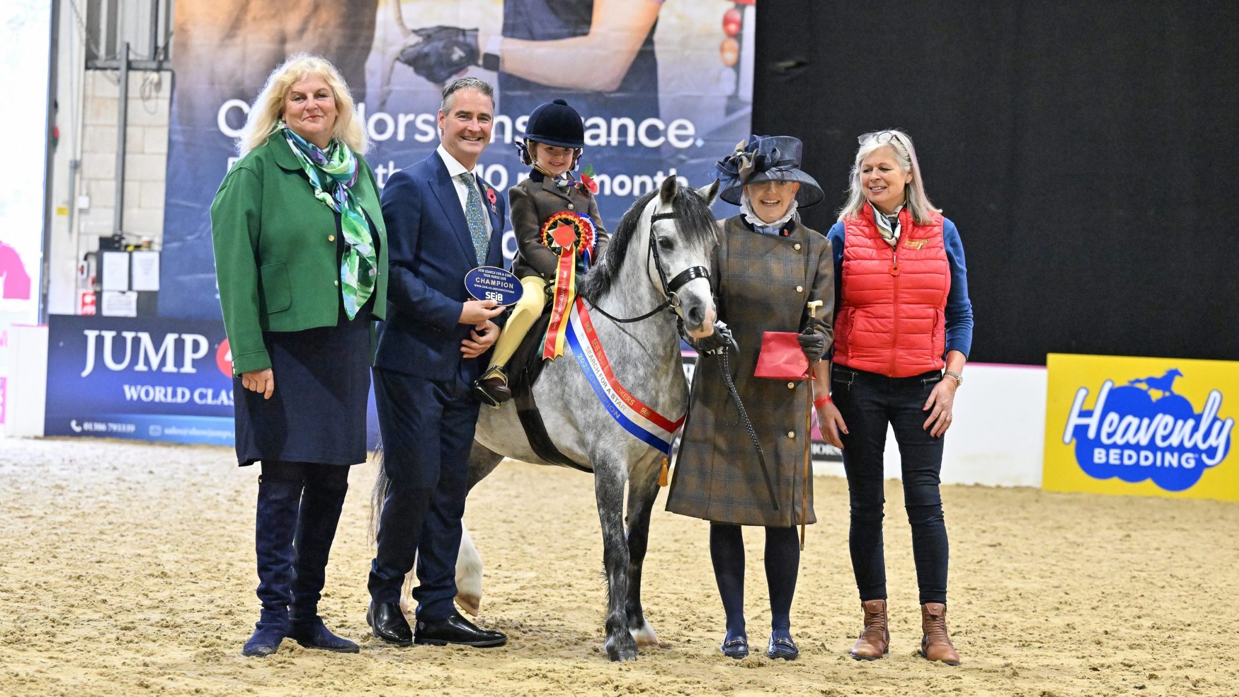 Efa Moore riding Thistledown Alice, lead by Laura Moore