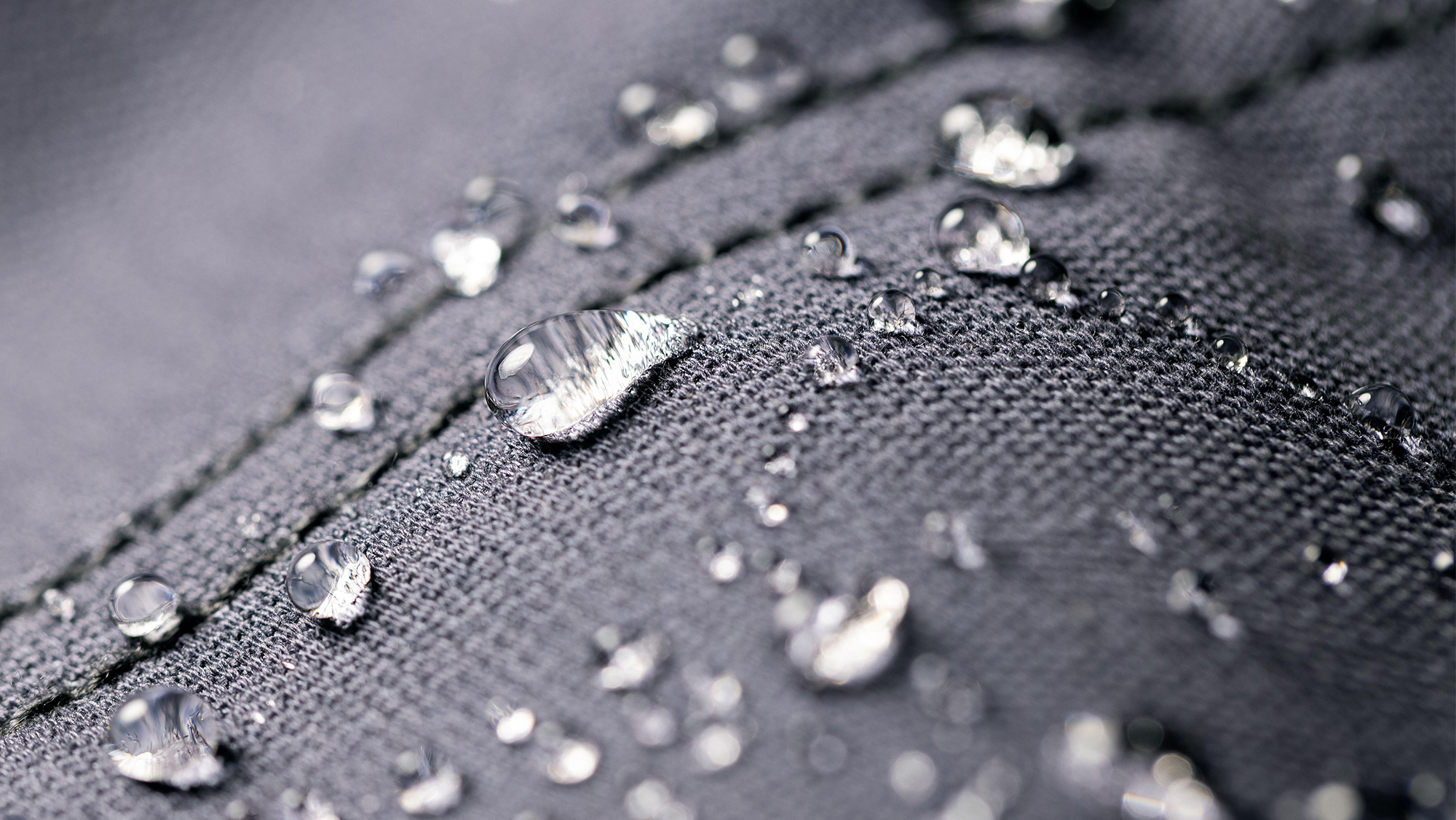 Close up of water beading up on waterproof material