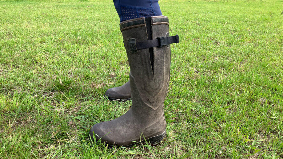 Lady in a field wear Aigle Parcours 2 Iso wellies showing adjustable gusset on the side