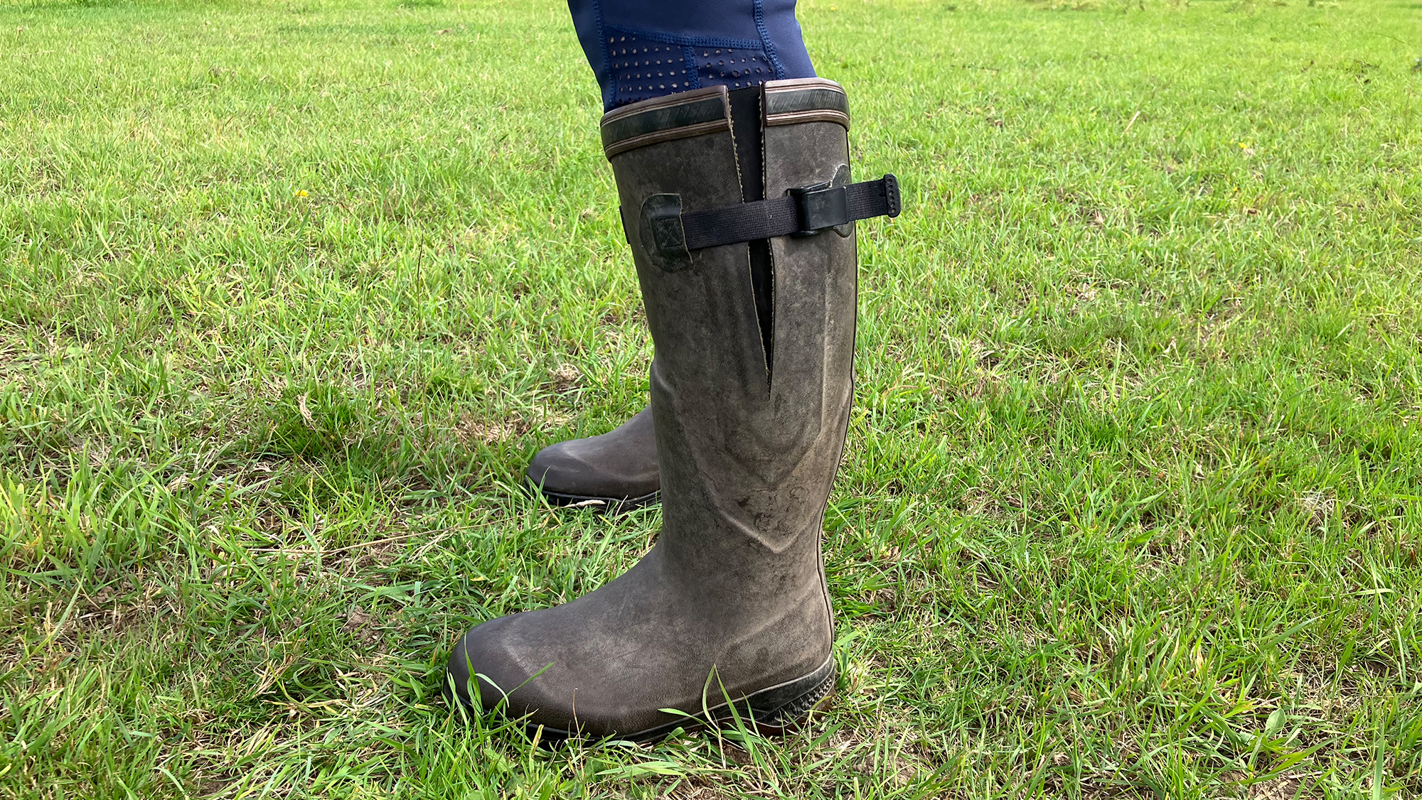 Lady in a field wear Aigle Parcours 2 Iso wellies showing adjustable gusset on the side