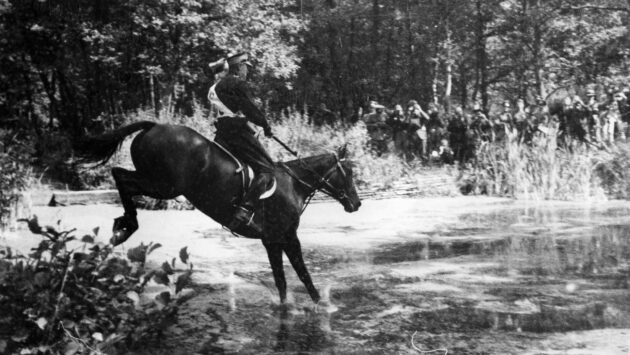 Seweryn Kulesza riding war horse Toska through water in the eventing at the 1936 Berlin Olympics